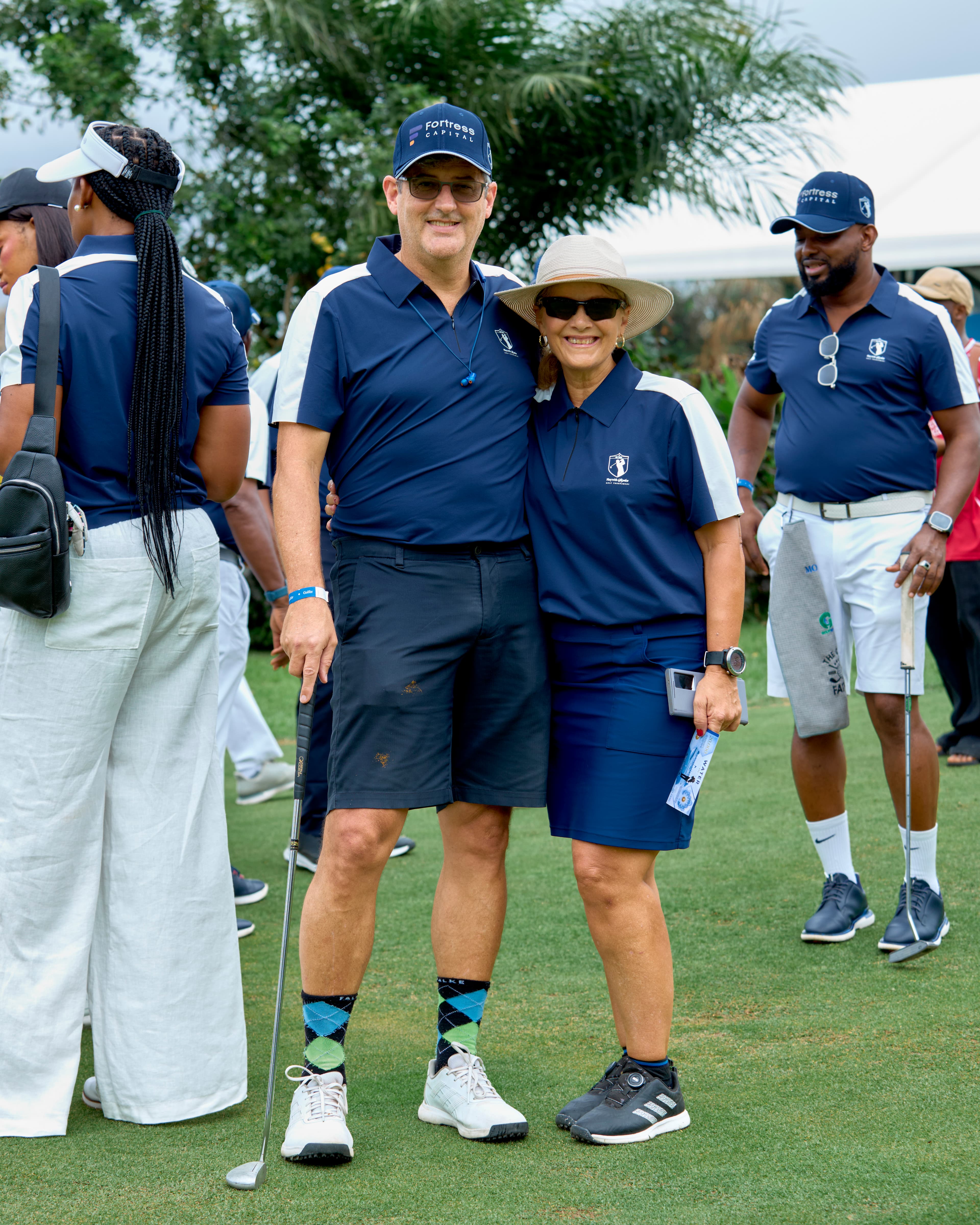 Golfers sharing a moment on the course at Play With Stephen